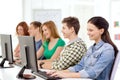 Female student with classmates in computer class Royalty Free Stock Photo