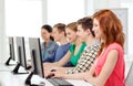 Female student with classmates in computer class Royalty Free Stock Photo