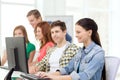 Female student with classmates in computer class Royalty Free Stock Photo