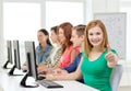 Female student with classmates in computer class Royalty Free Stock Photo