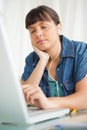 Female student falling asleep while doing her homework