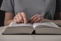 Female student hands close up, pointing on text in book or textbook, searching for information and reading at night Royalty Free Stock Photo