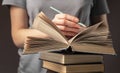 Female student hands underline information in book, prepare for exam, holding pencil. Education concept Royalty Free Stock Photo