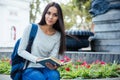 Female student holding book and looking at camera Royalty Free Stock Photo