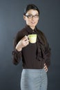 Female student holding a cup of coffee Royalty Free Stock Photo