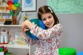 Female student hugging a handmade globe world at ecology classroom Royalty Free Stock Photo