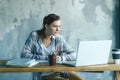 Female student with laptop on campus