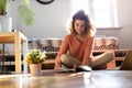 Female student learning in home setting with laptop Royalty Free Stock Photo