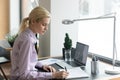 Focused millennial female student watching webinar on laptop Royalty Free Stock Photo