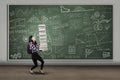 Female student lifting many books Royalty Free Stock Photo