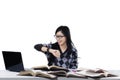 Female student looking at wristwatch Royalty Free Stock Photo