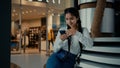 Female student middle-eastern girl businesswoman arabian ethnic woman student shopper chatting on phone sit at shopping Royalty Free Stock Photo