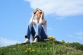 Female student outdoor on green grass with books Royalty Free Stock Photo