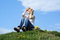 Female student outdoor on gren grass with books Royalty Free Stock Photo