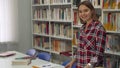 Female student poses at the library