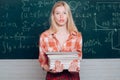 Female student ready to write exam testing. Blonde woman in front of chalkboard. Ready for study. Before exam Royalty Free Stock Photo