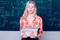 Female student ready to write exam testing. Blonde woman in front of chalkboard. Ready for study. Before exam Royalty Free Stock Photo