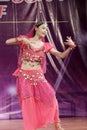 The female student in red perform indian dance