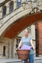 Female Student Riding Old Fashioned Bicycle Around Oxford University College Buildings By Bridge Of Sighs Royalty Free Stock Photo