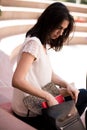 A female student searching for a book in her bag Royalty Free Stock Photo