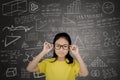 Female student standing with mathematics formula Royalty Free Stock Photo