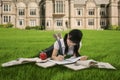 Female student studying on grass Royalty Free Stock Photo