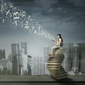 Female student studying on rooftop Royalty Free Stock Photo