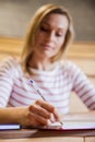 Female student taking notes in a class Royalty Free Stock Photo