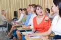 Female student talking with groupmates during classes Royalty Free Stock Photo