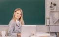 Female student in university, school education, Young woman study in college classroom on blackboard background. Royalty Free Stock Photo
