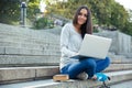 Female student using laptop computer outdoors Royalty Free Stock Photo