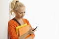 Female student using mobile phone Royalty Free Stock Photo