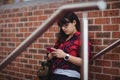 Female student using mobile phone Royalty Free Stock Photo