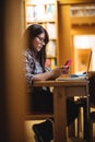 Female student using mobile phone Royalty Free Stock Photo