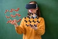 Female student wearing virtual reality glasses, holding molecular structure model. Science class, Education, VR, New Technologies. Royalty Free Stock Photo