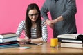 Female student working one to one with tutor. Tutor helping student to prepare for exams Royalty Free Stock Photo