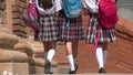 Female Students With Backpacks