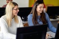 Female students enjoying an informatics lecture. Smart young people study at the college. Education, college, university, learning Royalty Free Stock Photo