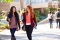 Female Students Walking Outdoors On University Campus Royalty Free Stock Photo