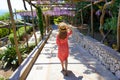 Female stylish tourist descent pathway garden of Capri, Naples, Italy Royalty Free Stock Photo