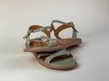 Female summer sandals are light gray in color. Pair of female beautiful light summer sandals. Modern summer female shoes