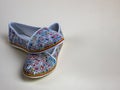 Female summer slippers with a beautiful motley pattern. A pair of beautiful light summer shoes female. Modern summer
