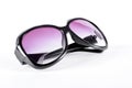 Female sunglasses with purple glass. Royalty Free Stock Photo