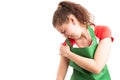 Female supermarket employee suffering shoulder pain Royalty Free Stock Photo