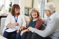 Female Support Worker Visits Senior Couple At Home Royalty Free Stock Photo