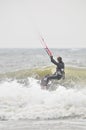 Woman Surfer kite-surfing in spray. Royalty Free Stock Photo