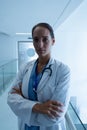 Female surgeon with arms crossed in the corridor Royalty Free Stock Photo