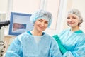Female surgeon with assistant in operation room
