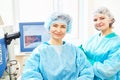 Female surgeon with assistant in operation room