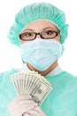 Female surgeon doctor holding money Royalty Free Stock Photo